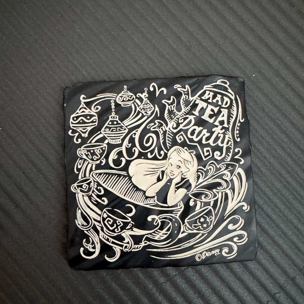 Disney Parks Alice in Wonderland stone etched decor